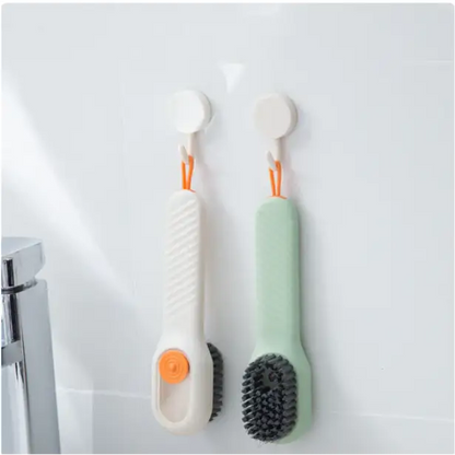 Shoes cleaning brush with fluid dispenser